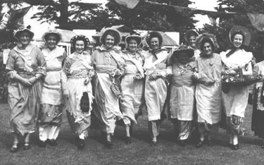Group of women in costume at Olde English Fayre. 	
