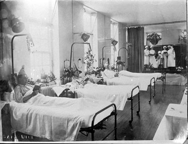 Carols in hospital ward, Christmas 1932. 	